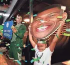  ?? ANGELA PETERSON / MILWAUKEE JOURNAL SENTINEL ?? Milwaukee Bucks fan Ximena Guerrero, 6, celebrates at The MECCA Sports Bar and Grill when Giannis Antetokoun­mpo is announced as the MVP at the 2019 NBA Awards.