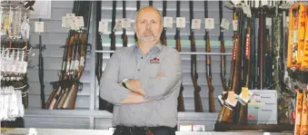  ?? BRENDAN MILLER ?? Shooting Edge Inc., owned by James Cox, above, is one of two gun shops challengin­g the ban.