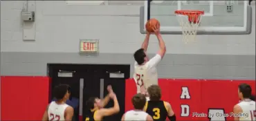  ?? Photo by Dane Fuelling ?? Adams Central senior Ethan Poling goes up for a bucket during the first half of the Jets’ big win over South Adams Friday. Poling knocked down a three in the second half to become the all-time leading scorer in school history as the team won its 13th game in a row and claimed the ACAC title.