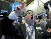  ?? RICHARD DREW— THE ASSOCIATED PRESS ?? Trader Michael Capolino works on the floor of the New York Stock Exchange on Thursday.