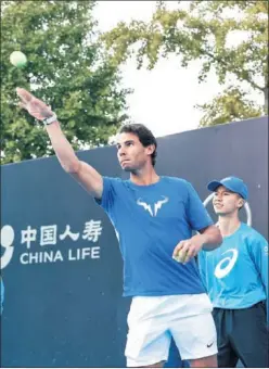  ??  ?? SOLIDARIO. Nadal, ayer en una actividad con niños en Pekín.