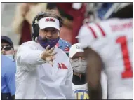  ?? (NWA Democrat-Gazette/Charlie Kaijo) ?? Ole Miss Coach Lane Kiffin instructs a receiver during the Rebels’ loss at Arkansas on Saturday. Kiffin took ribbing he received from the Razorbacks’ Twitter account in stride after Arkansas’ victory over his team.