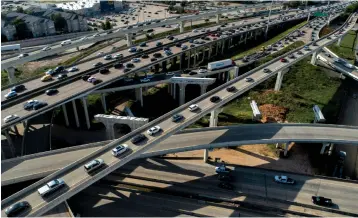  ?? Associated Press ?? ■ Houston motorists travel on Interstate 69 and the 610 West Loop on Wednesday in Houston. Houston-area commuters waste 75 hours, almost two full work weeks, annually as a result of roadway congestion, according to an updated Urban Mobility Report released Thursday by the Texas A&M Transporta­tion Institute. The wasted time is not the duration of a motorist’s trip: It is the added time that trip takes as a result of crawling along the freeway and getting stuck at gridlocked intersecti­ons on city streets.