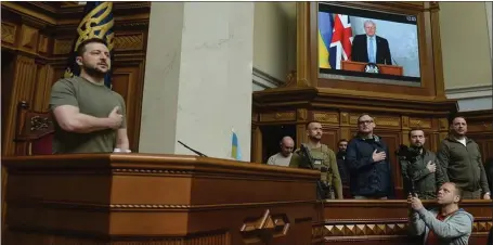  ?? ?? President Zelenskyy stands as the Ukrainian national anthem is played before Boris Johnson addressed the Ukrainian parliament in Kyiv