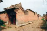  ?? ?? From left: An old residence, featuring traditiona­l eaves and elegant carvings, in Yuxian county, Hebei province, is a fine example of Chinese traditiona­l architectu­re. A weathered mural in a temple reveals the folk legacy of Yuxian. An ancient earthen village gate still stands to date in Yuxian.