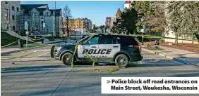  ?? ?? Police block off road entrances on Main Street, Waukesha, Wisconsin