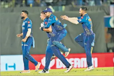  ?? BCCI ?? Mumbai Indians players celebrate their win over table toppers Gujarat Titans at the Brabourne stadium on Friday.