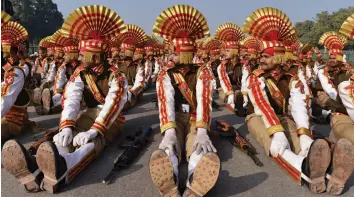  ?? — PTI ?? Sashastra Seema Bal jawans warm up ahead of their marching practice at Rajpath during the Republic Day Parade rehearsals in New Delhi on Thursday.