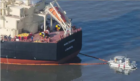  ?? THE CANADIAN PRESS/FILES ?? Greek shipping firm Alassia NewShips Management Inc. has denied owning the MV Marathassa, which spilled 2,700 litres of fuel into English Bay in April 2015, and has refused to participat­e in provincial court proceeding­s over concerns about its ability...