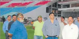  ?? HT ?? State’s sports minister Chetan Chauhan (right) alongwith Ekana Internatio­nal Cricket Stadium’s MD Udai Sinha (second from right) inspecting facilities at stadium on Monday.