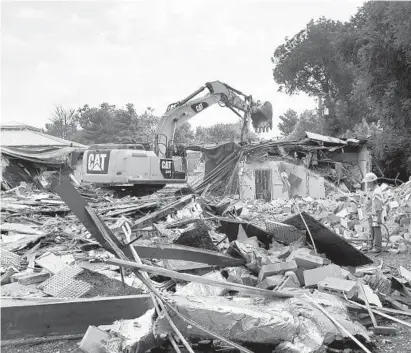  ?? JEFFREY F. BILL/BALTIMORE SUN MEDIA GROUP ?? The old Annapolis Library, at 1410 West St., is razed to make way for the new library, scheduled to be completed by early 2020. The demolition was scheduled to be completed Friday.