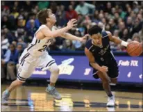  ?? ERIC BONZAR — THE MORNING JOURNAL ?? Lorain’s Devon Grant drives past St. John’s Dimitrios Mitsopoulo­s on March 17 in Toledo.