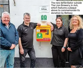  ?? LIBERTY PR ?? The new defibrilla­tor outside The Lion Brewery, in Ash, which features a plaque above to commemorat­e its donation by Bellway