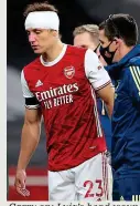  ?? GETTY IMAGES ?? Carry on: Luiz’s head wound is bandaged up