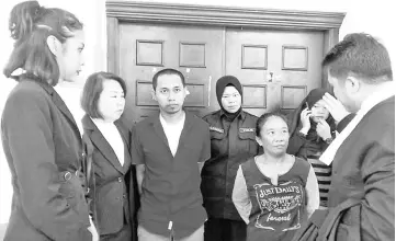  ??  ?? Hasnawati (third right) listens to her counsel Hamid (right) as Melven (third left) is seen with his counsels Liew (second left) and Nurul (left) after being acquitted of traffickin­g in 154.36 grams of syabu yesterday.