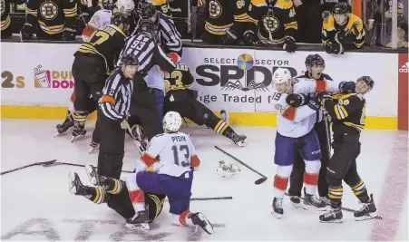  ?? STAFF PHOTOS BY NICOLAUS CZARNECKI ?? PUNCH UP: The Bruins and Panthers beat each other up yesterday at the Garden, but Nick Holden (below, left) and the hosts got the best of things on the scoreboard.