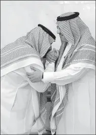  ?? AP/AL-EKHBARIYA ?? Mohammed bin Salman (left), newly appointed as crown prince, kisses the hand of Prince Mohammed bin Nayef at the royal palace Wednesday in Mecca, Saudi Arabia.