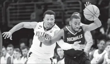  ?? STEVEN M. FALK/TRIBUNE NEWS SERVICE ?? Villanova's Jalen Brunson, left, tries to take the ball from Nicholls State's Lafayette Rutledge during the first half in Philadelph­ia on Tuesday.