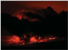  ?? (AP/Gregory Bull) ?? Lava flows from the Mauna Loa volcano Friday near Hilo, Hawaii.