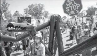  ?? -AP ?? SOLWAY, MINN
Activist Jane Fonda joins hundreds of protesters chanting "Stop Line 3!" and "Water is life!" gathered at the headwaters of the Mississipp­i River in in Solway, Minn to resist a Canadian-based company's plan to replace an aging pipeline that carries crude oil from Alberta to Wisconsin.