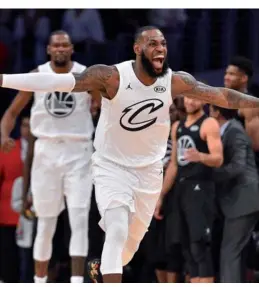  ?? BOB DONNAN / USA TODAY SPORTS ?? LeBron James celebrates leading his team to victory in the 2018 NBA All-Star Game at Staples Center in Los Angeles on Sunday. James scored 29 points and hit the go-ahead layup with 34.5 seconds to play — helping earn the Cleveland Cavaliers forward a...