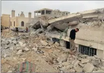  ?? PICTURE: REUTERS ?? People inspect a damaged mosque after an air strike on the rebel-held village of Jinah near Aleppo, Syria.