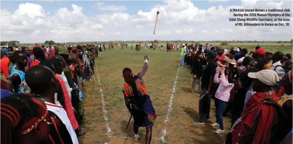  ??  ?? REUTERS A MAASAI moran throws a traditiona­l club during the 2017 Maasai Olympics at the Sidai Oleng Wildlife Sanctuary, at the base of Mt. Kilimanjar­o in Kenya on Dec. 10.