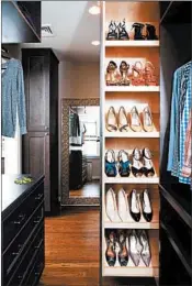  ?? STACY ZARIN GOLDBERG/CASE DESIGN ?? A retractabl­e shoe storage area in this closet designed by Eskandari keeps shoes organized and easily visible.