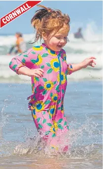  ??  ?? Flo, three, having fun in Polzeath, Cornwall, yesterday