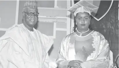  ?? Photo: Felix Onigbinde ?? Ruqayyah Kabiru Yusuf (right) poses with Prof. Buba Bajoga after receiving the best student award during the Abuja Capital Internatio­nal College’s 10th graduation and awards day held in Abuja recently.