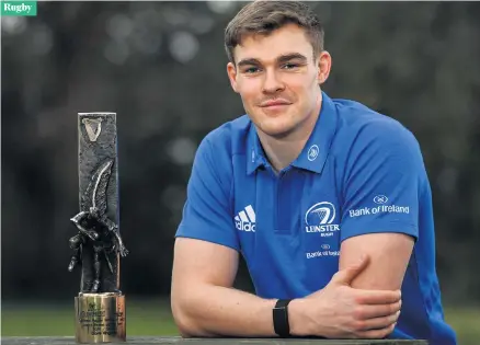  ??  ?? Top of the class:
Ireland centre Garry Ringrose with his Guinness Rugby Writers of Ireland Player of the Season award