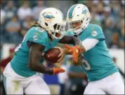  ?? WINSLOW TOWNSON — THE ASSOCIATED PRESS FILE ?? In this file photo, Miami Dolphins quarterbac­k Jay Cutler hands the ball off to running back Jay Ajayi during an NFL preseason football game against the Philadelph­ia Eagles in Philadelph­ia. There’s confusion in the Dolphins’ backfield. For Jay Ajayi,...