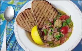  ?? SARA MOULTON VIA AP ?? Clam, tomato and bacon stew with grilled garlic bread