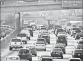  ?? DAMIAN DOVARGANES/AP 2018 ?? U.S. consumers will soon have a greater selection of fully electric vehicles. Above, a traffic jam in Los Angeles.