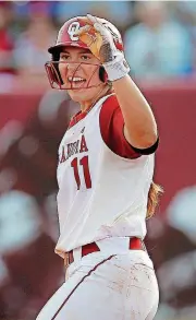  ??  ?? Nicole Mendes of Oklahoma celebrates a hit in the fourth inning of an NCAA regional softball game against Boston on Friday at Marita Hynes Field in Norman. OU run-ruled the Terriers, 9-0.