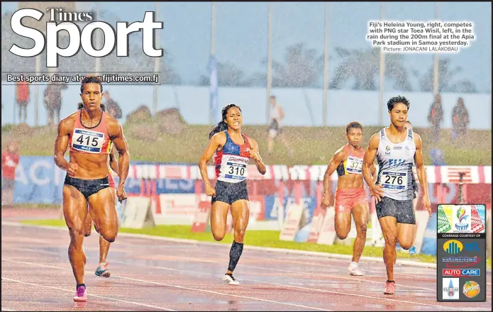  ?? Picture: JONACANI LALAKOBAU ?? Fiji’s Heleina Young, right, competes with PNG star Toea Wisil, left, in the rain during the 200m final at the Apia Park stadium in Samoa yesterday.
