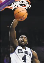  ?? Corey Perrine / Getty Images ?? Villanova’s Eric Paschall dunks as the No. 1 Wildcats ran all over Seton Hall.