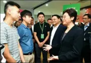  ?? SERVICES DEPARTMENT INFORMATIO­N ?? Chief Executive Carrie Lam Cheng Yuet-ngor exchanges views with young people from Hong Kong and the mainland at the Qianhai Shenzhen-Hong Kong Youth Innovation and Entreprene­ur Hub in Shenzhen on Thursday.