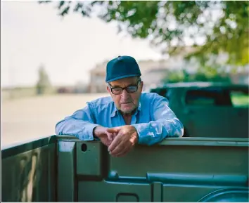  ??  ?? Below AUTHENTICI­TY A retired farmer having a tailgate discussion, shot in Alberta, Canada, 2015 Opposite
GROCERY STORE WORKER Think about your subjects as characters and consider their place in the overall narrative