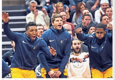  ?? — AP ?? Reason to rejoice: (From left) Utah Jazz’s Donovan Mitchell, Kyle Korver, Ricky Rubio and Royce O’Neale celebrate after their team score against the San Antonio Spurs in the second half of their NBA game on Tuesday.