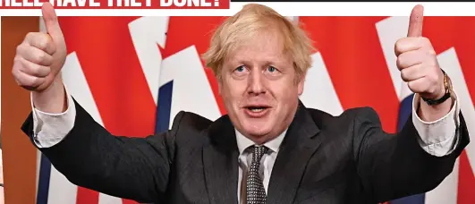  ?? ?? Getting Brexit done: Boris Johnson gives the thumbs up after signing a Brexit trade deal with Brussels in December 2020