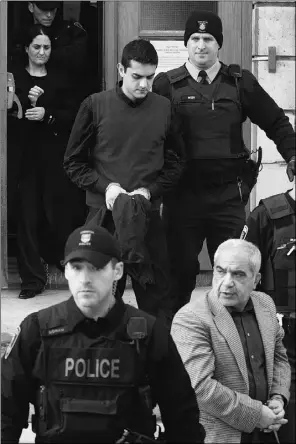  ?? Lars Hagberg, Reuters ?? Mohammad Shafia, front right, his son Hamed Shafia, centre, and his wife Tooba Mohammad Yahya, top left, leave the courthouse in Kingston, Ont. on
Sunday after being found guilty of first-degree murder.