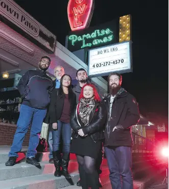  ?? GAVIN YOUNG ?? Teacher Graham Mackenzie, far right, with other volunteers who are putting on an all-ages music show at the Paradise Lanes bowling alley. The event is one of several they have organized for youth and newcomer students in Calgary to provide a look at...