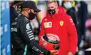  ??  ?? Mick Schumacher presents a helmet belonging to the German’s father after Lewis Hamilton equalled Michael’s record of 91 race victories. Photograph: Peter Fox/Getty Images