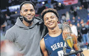  ?? AP ?? Lebron James with son Bronny after Sierra Canyon won a high school basketball game.