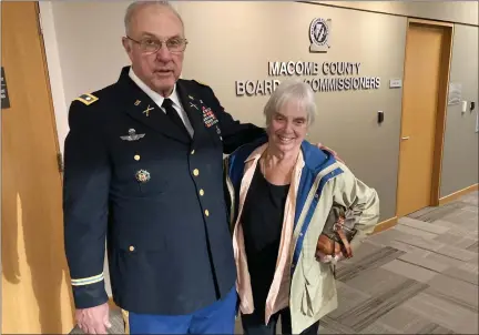  ?? PHOTOS BY JAMESON COOK—THE MACOMB DAILY ?? John Walus with his wife, Debbie, on Monday minutes after being named the Macomb County Pat Daniels Veteran of the Year.