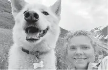  ?? AMELIA MILLING VIA AP ?? Amelia Milling shows with a seven-year-old Alaskan husky named Nanook, that is credited with helping rescue her when she was injured while hiking a trail in Chugash State Park east of Anchorage, Alaska.