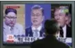  ?? LEE JIN-MAN - THE AP ?? A man watches a TV screen in March showing file footages of U.S. President Donald Trump, right, South Korean President Moon Jaein, center, and North Korean leader Kim Jong Un, left, during a news program at the Seoul Railway Station in Seoul, South...