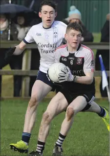  ??  ?? Connor Murray wins possession for St Attracta’s.