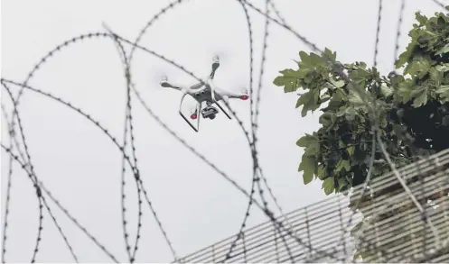  ?? PICTURE: GUERNSEY PRESS/SWNS ?? 0 Drones and quadcopter­s have been used to get contraband items into prisons across the UK